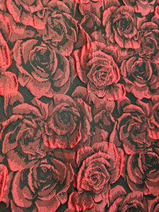 Close up view of red rose textured brocade