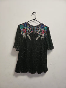 back view of 80s top with flower adorned beaded top