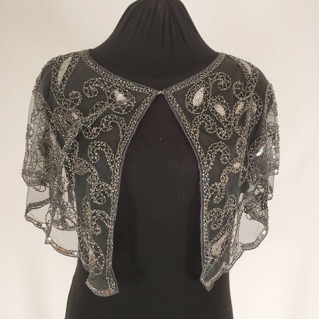 front view of Antique silver sequin beaded capelet shrug