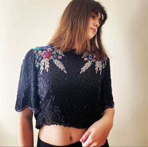 80s top with flower adorned beaded top on model