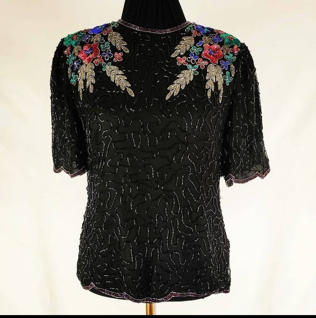 front view of 80s top with flower adorned beaded top on mannequin